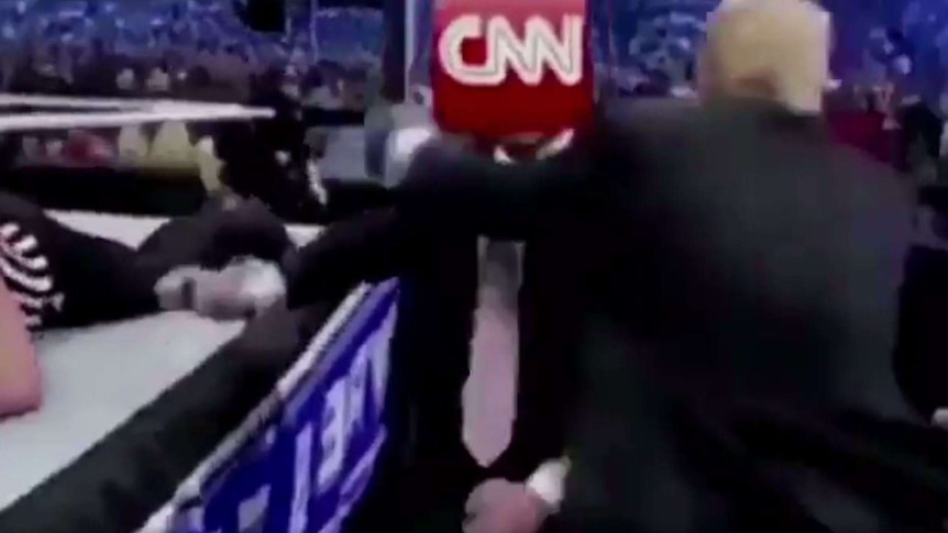 A screenshot from a mock video Donald Trump tweet showing him body slamming CNN in a wrestling match.