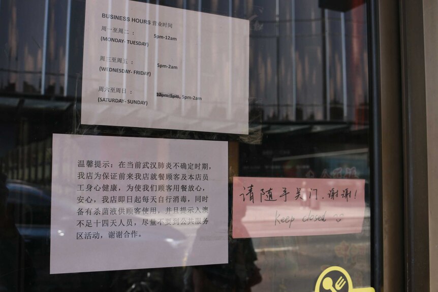 A sign inside a restaurant in Box Hill advises people who have recently been to China to self-isolate for 14 days.