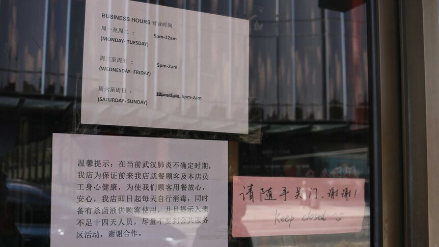 A sign inside a restaurant in Box Hill advises people who have recently been to China to self-isolate for 14 days.