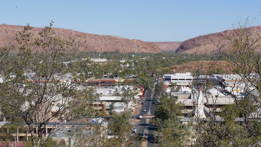 Tree in foreground, looking down over Alice Springs from ANZAC Hill.