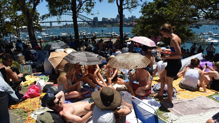 Crowds gather at Mrs Macquarie's Chair on the foreshore of Sydney Harbour for the New Years Eve fireworks.