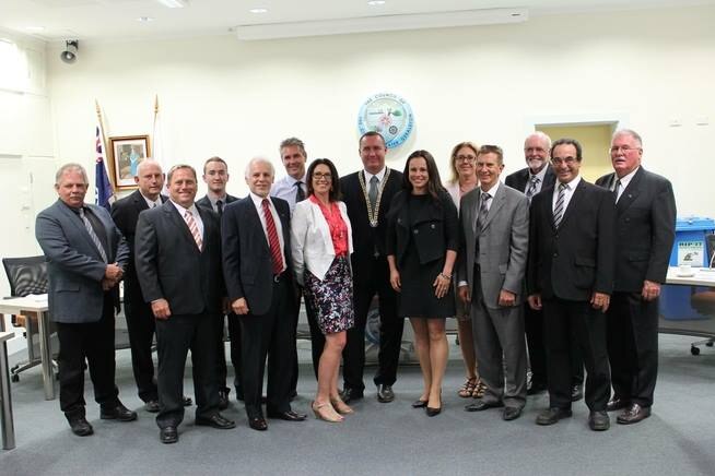 City of Geraldton councillors pose for a photo inside a council room.