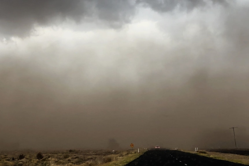 dark dust clouds over a highway