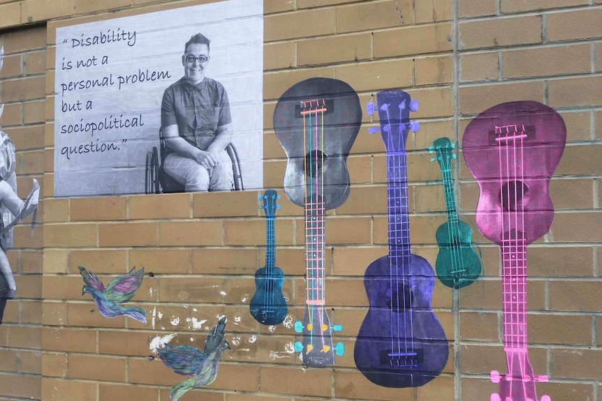 A close up of the Disability Pride mural on the Footscray Exchange building.
