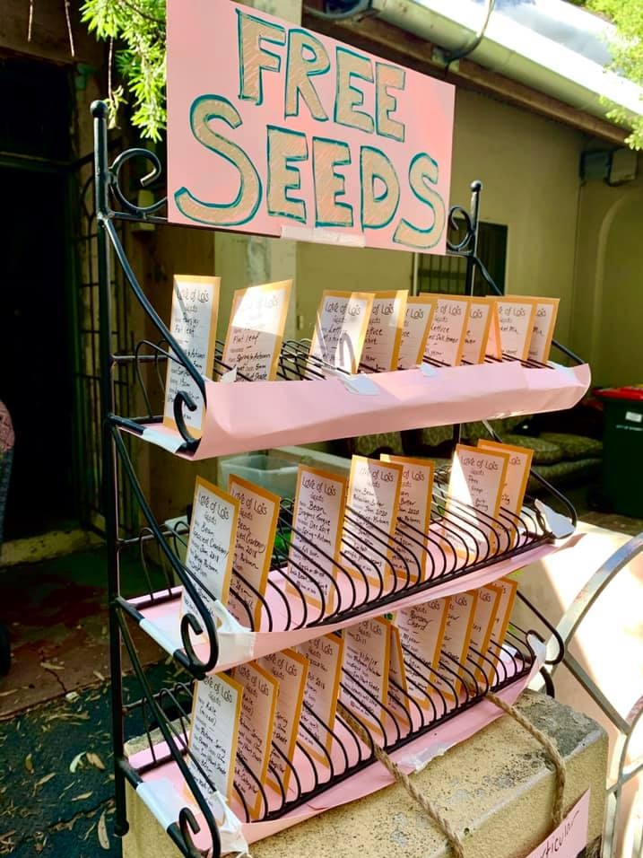 Free seeds in a rack outside a home.