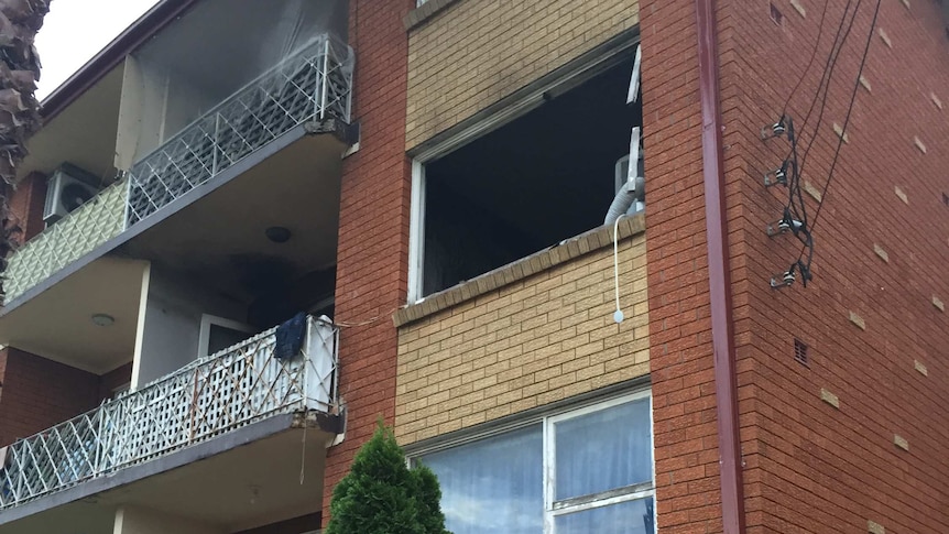 A woman was trapped in a second floor unit when a fire started in the kitchen.