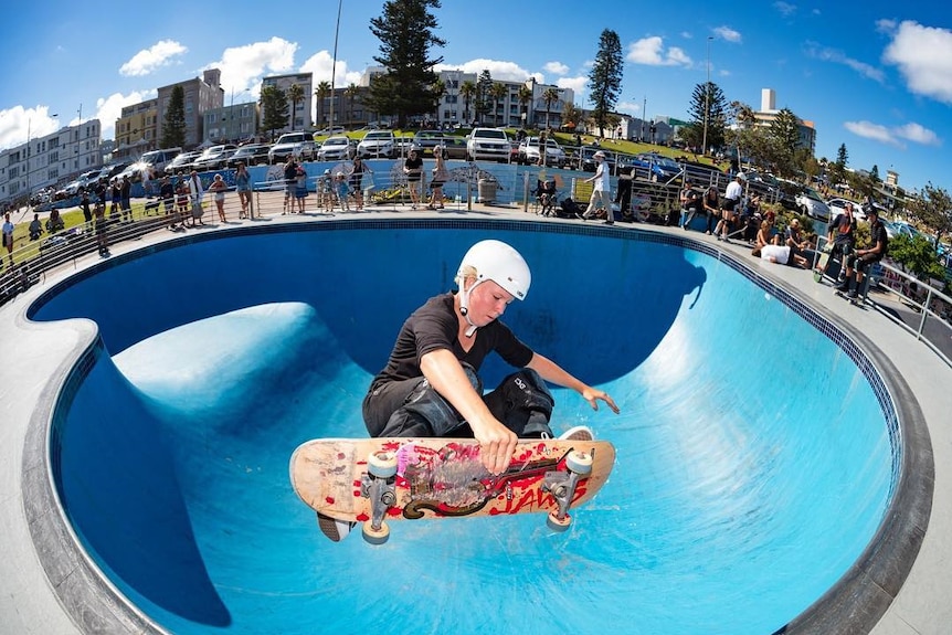 Skateboarder performing an aerial manoeuvre at Bondi Skate Park bowl.