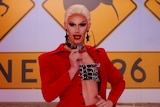 White drag queen Scarlet Adams enters the workroom in RuPaul's Drag Race Down Under