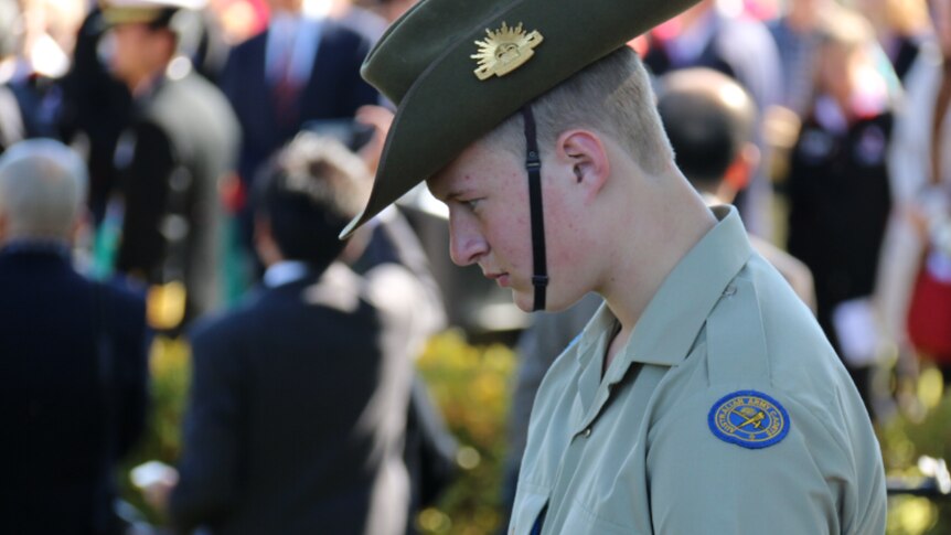 An army cadet pauses at the Cowra prison breakout 70th anniversary service in Cowra on August 5, 2014.