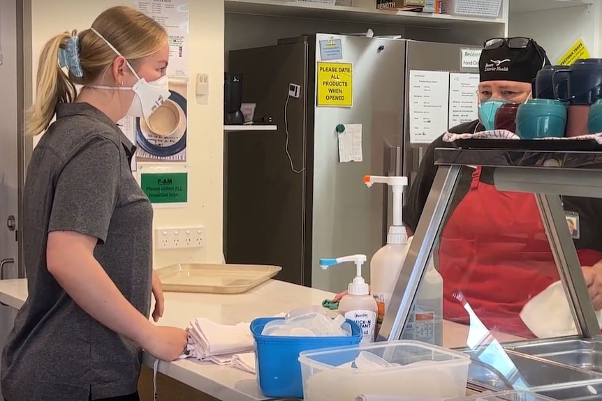 A photo of a student working in a kitchen 