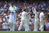Kevin Pietersen walks back to the pavilion after being dismissed by Australia's Ryan Harris