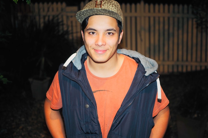 young man in shirt and hat