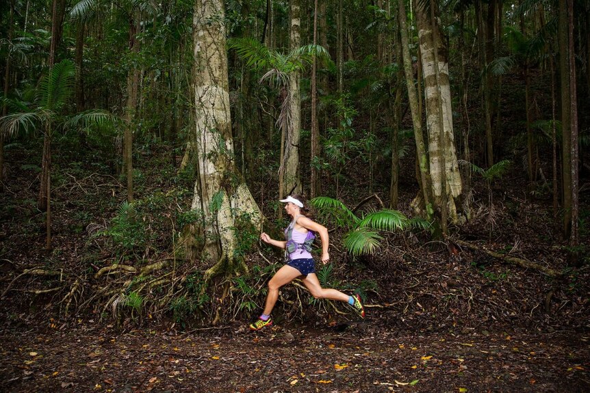 Shona Stephenson running in forest