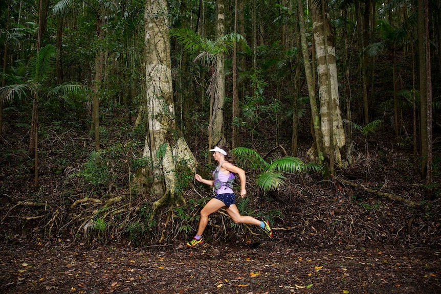 Shona Stephenson running in forest