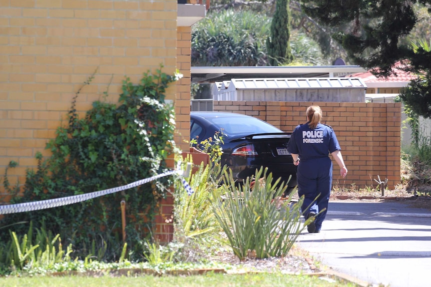 A forensics officer at a crime scene in Yokine.