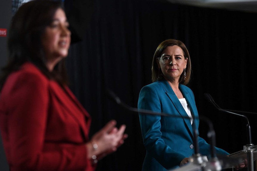 Deb Frecklington watching Annastacia Palaszczuk