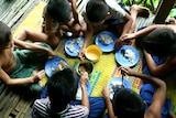 Orphans at the Wat Norea home eat dinner