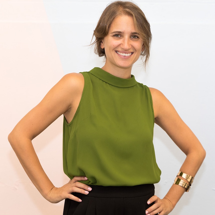 Businesswoman Sheree Rubinstein in an olive green top in front of white background.