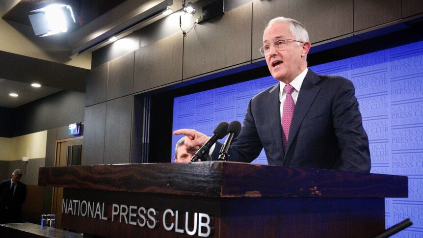 Prime Minister Turnbull speaking from a lectern.