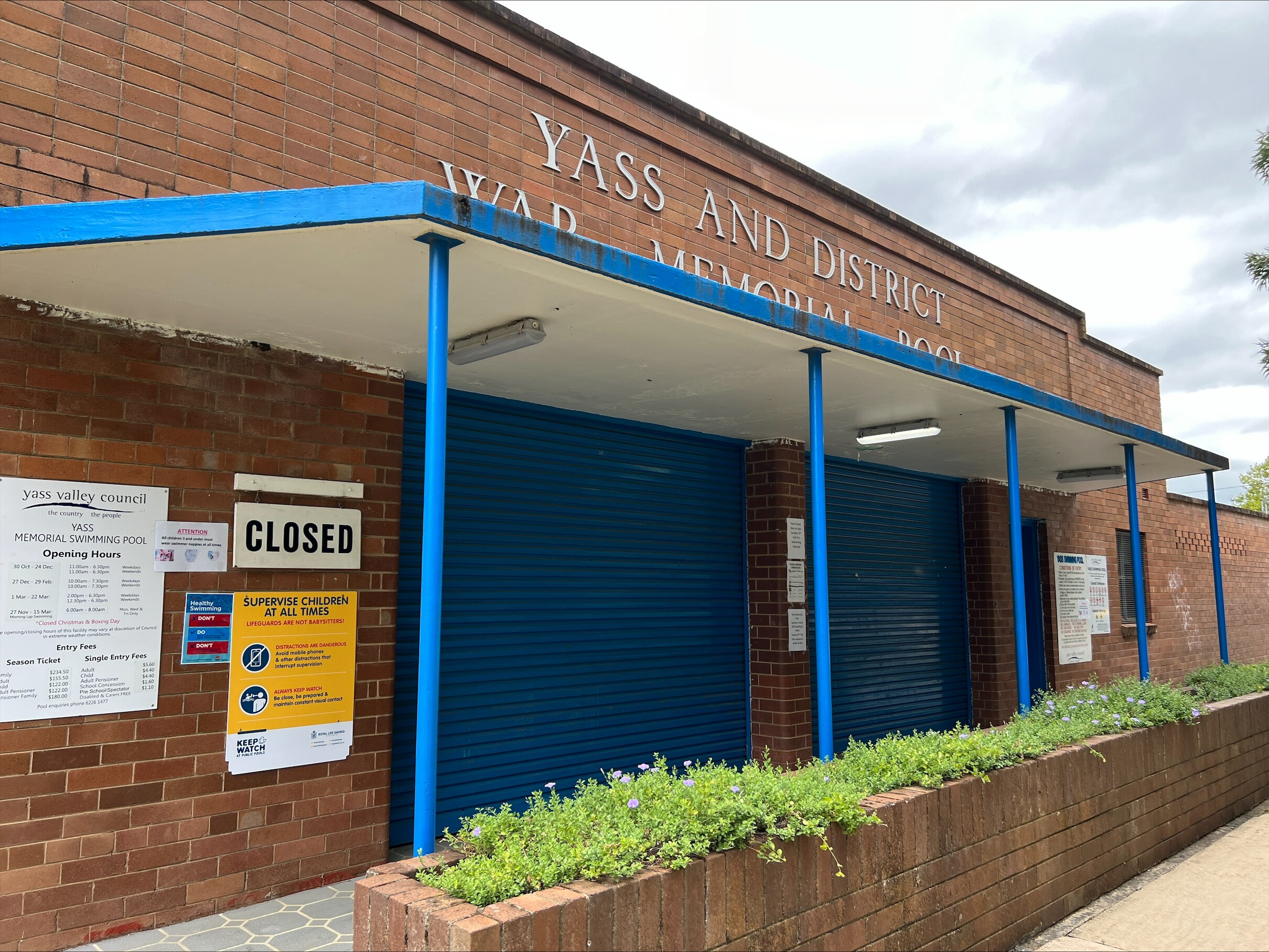 Yass and District War Memorial Pool with its shutters down and a closed sign.