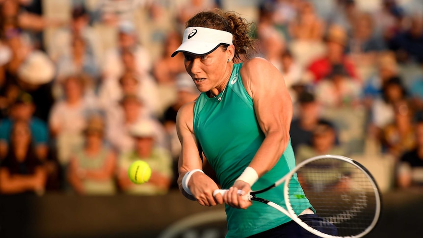 Samantha Stosur strains every muscle as she hits a backhand at the Brisbane International