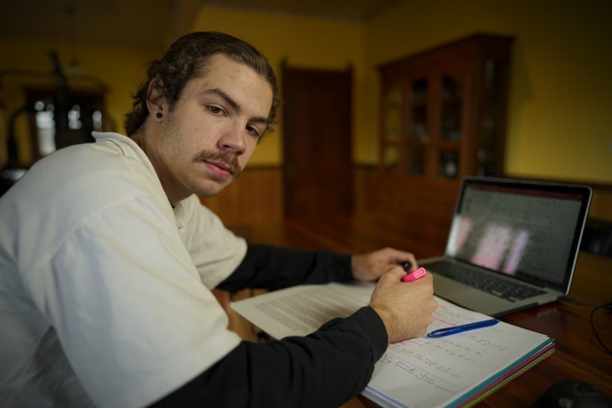 As young man working at a laptop.