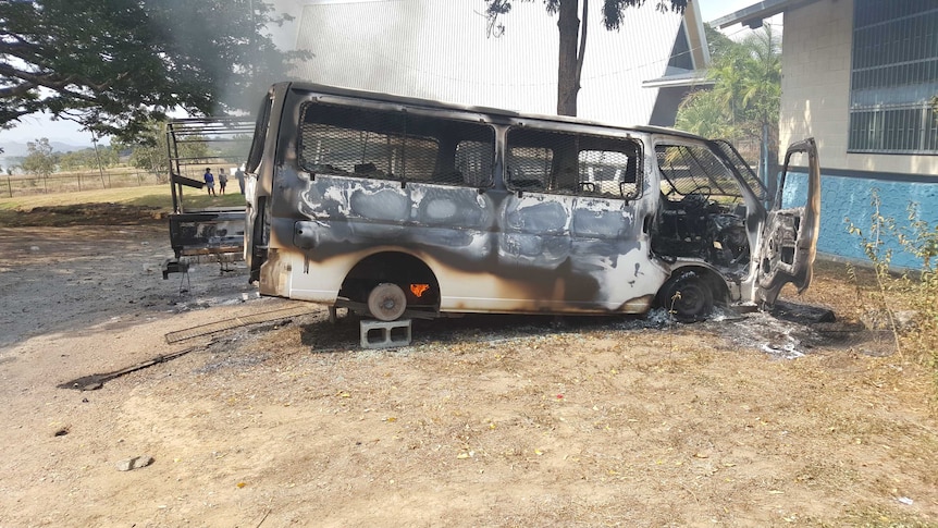 Burnt out van at UPNG