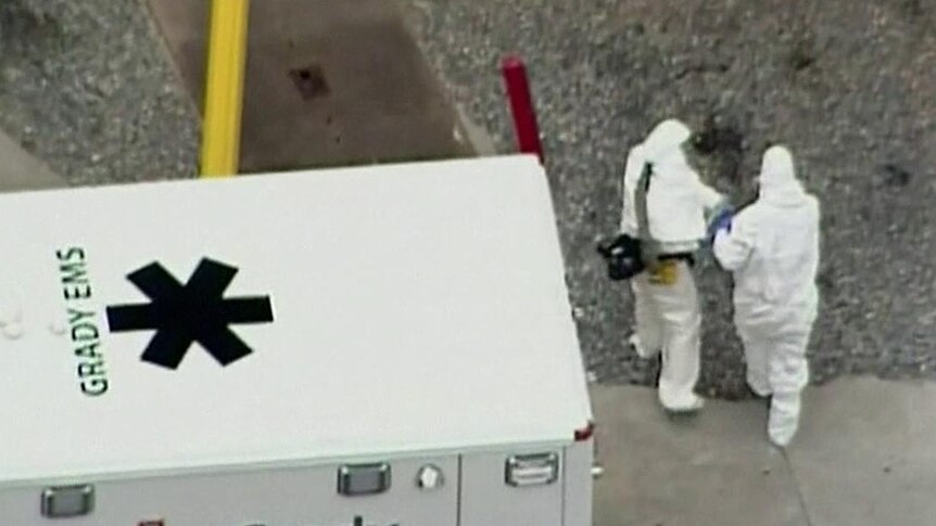 Doctor Kent Brantly is escorted from ambulance into Emory University Hospital in Atlanta