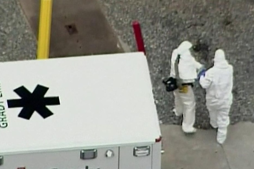 Doctor Kent Brantly is escorted from ambulance into Emory University Hospital in Atlanta