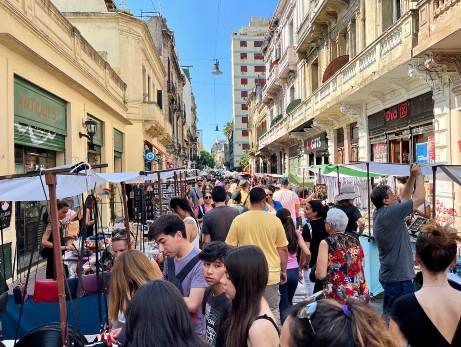 Crowds of people in an outdoor market.