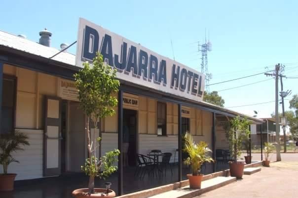 A country pub on a dusty street.