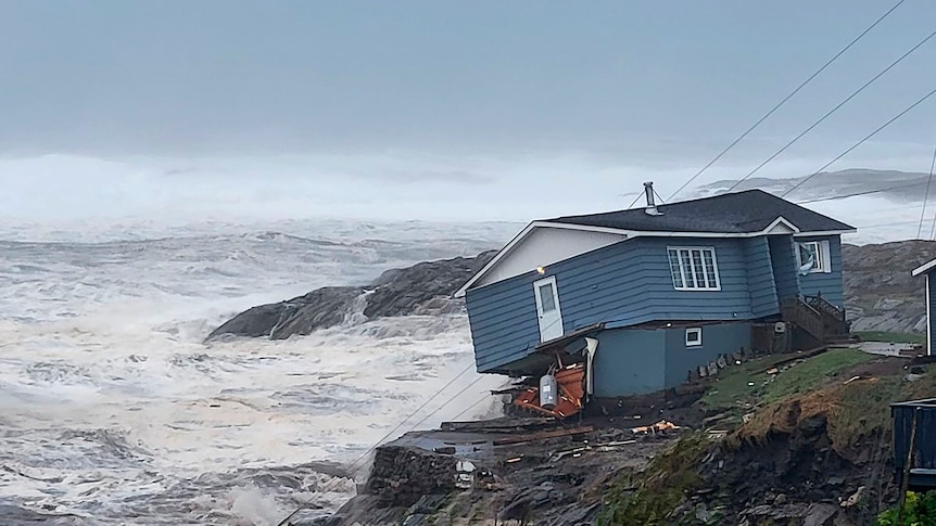 A house on the coast has been damaged by high winds in the storm as it clings to land. 