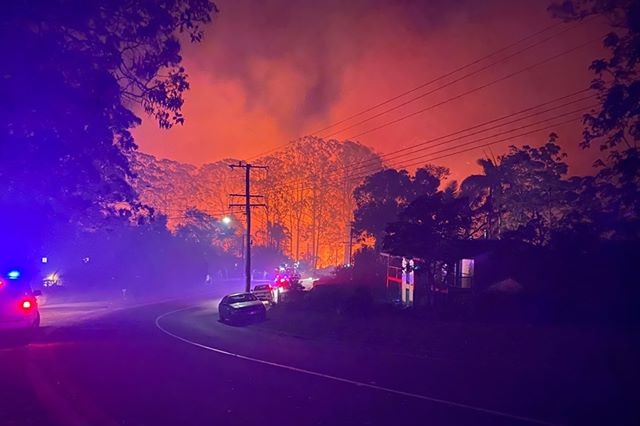 Fire burning close to properties in Lower Beechmont