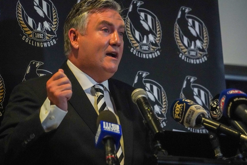 Close-up shot of Eddie McGuire behind microphones.