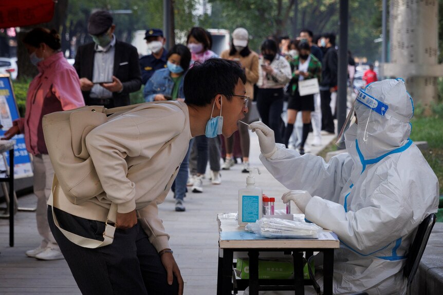 A man gets a PCR COVID test in Beijing, China