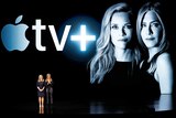 Reese Witherspoon and Jennifer Aniston on a stage talking about Apple TV