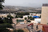An ultra-Orthodox Jew walks in Ramat Shlomo settlement.