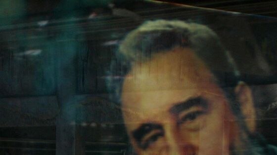 A poster of Cuban President Fidel Castro sits in the window of a shop in Havana