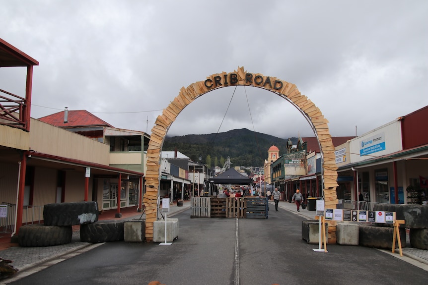 Main street of Queenstown empty with signage for an arts festival.