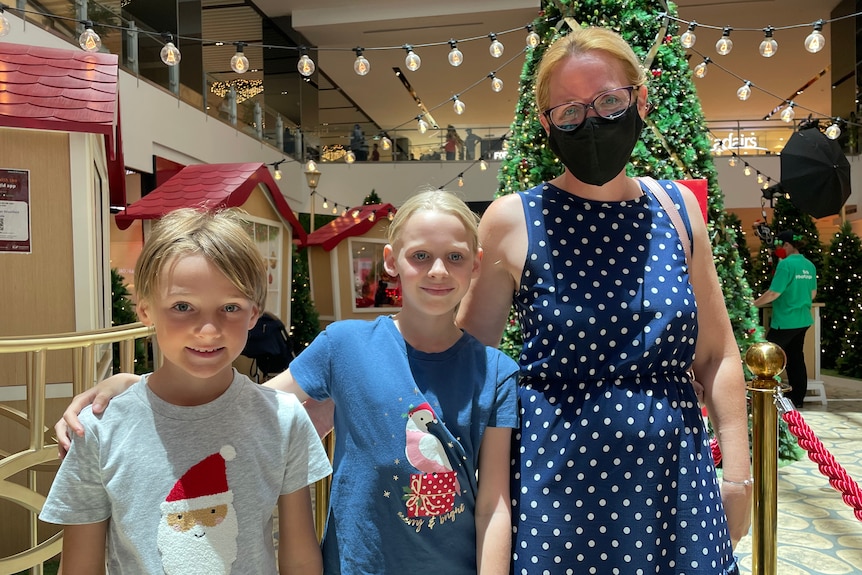 Amie Kinnane and her children Charlie and Evie at the Chermside shopping center.