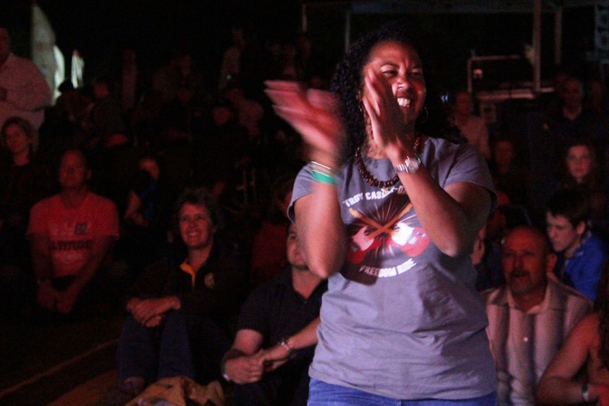 Barcaldine's Cheryl Thompson dances along at a drought relief concert in Longreach.