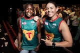 Priscilla Odwogo and Rachael Duffy showing off the foundation jumper or guernsey design at launch of the Tasmania Football Club.