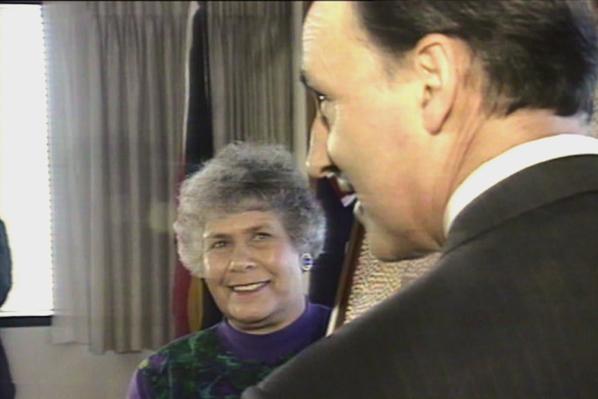 A screenshot from an old television prodcast showing an Indigenous Australian woman smiling at then-PM Paul Keating