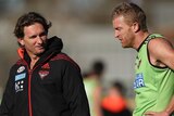 Bombers coach James Hird talks with Dustin Fletcher at Essendon Bombers training