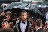 British singer Robbie Williams beneath umbrellas at the ARIA Awards.