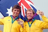 Nathan Outteridge and Iain Jensen (L) hold their gold medals won in the 49er sailing class.