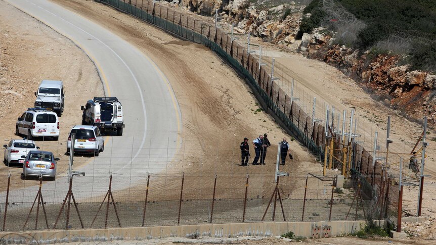 Israeli security forces inspect the area where two Palestinian teenagers were shot dead.