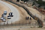 Israeli security forces inspect the area where two Palestinian teenagers were shot dead.