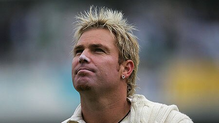 Shane Warne looks to the heavens after bad light forced a delay