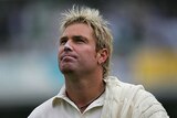Shane Warne looks to the heavens after bad light forced a delay